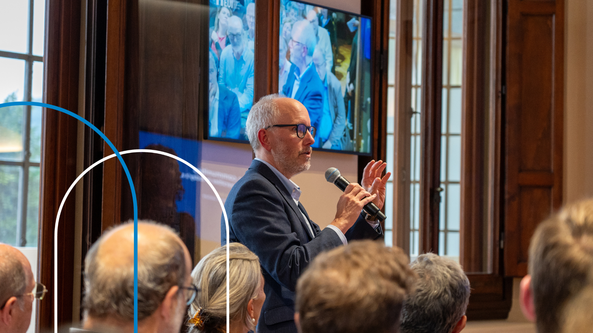 Erik Jones speaking on a microphone during a conference