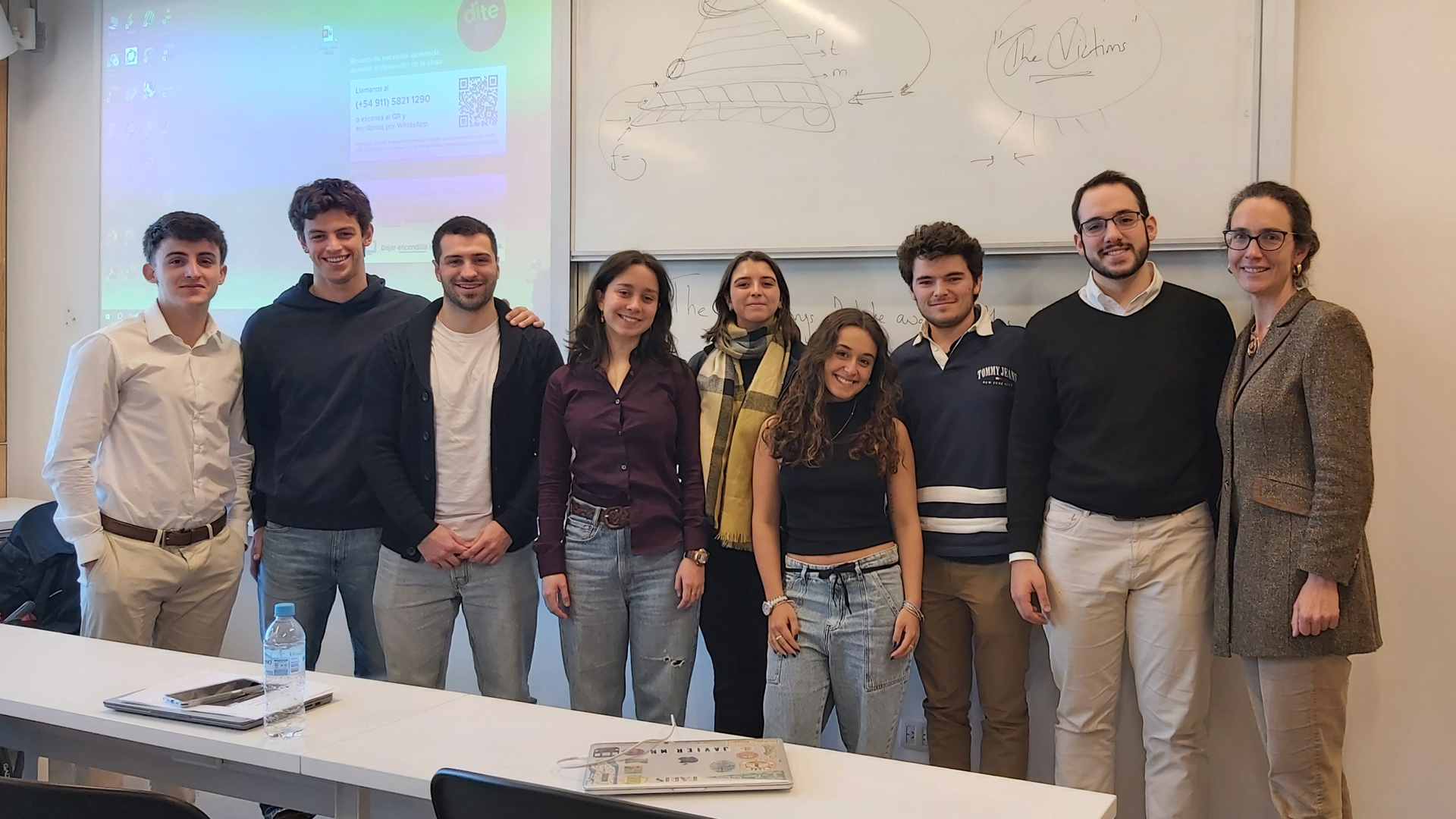 Group of people in classroom posing